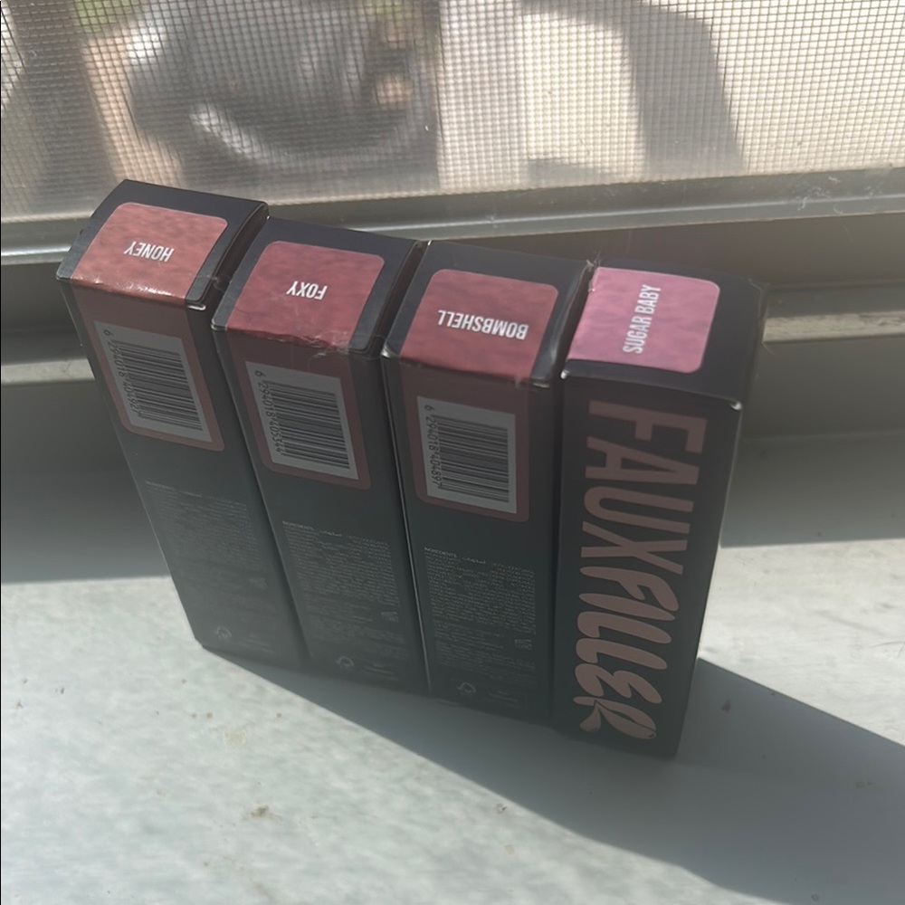 Fauxfiller Lipglosses—Honey, Foxy, Bombshell, Sugar baby